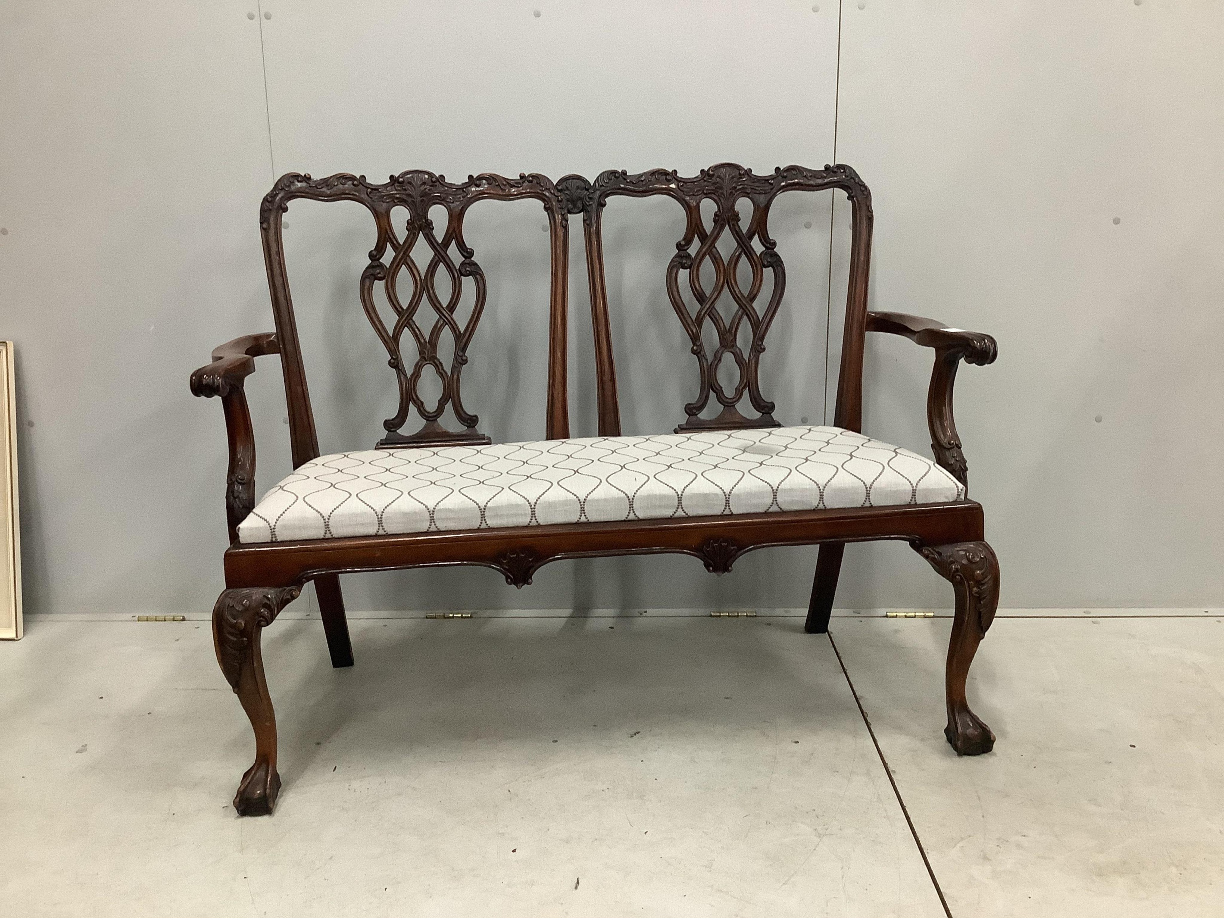 A Chippendale Revival mahogany chair back settee, width 137cm, height 103cm. Condition - good but for a stain on the fabric of the seat